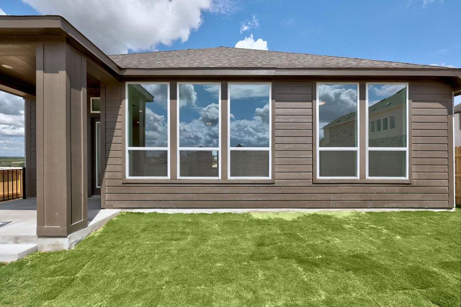 Exterior details and patio area of a home in Lariat, Liberty Hill (Image 15).