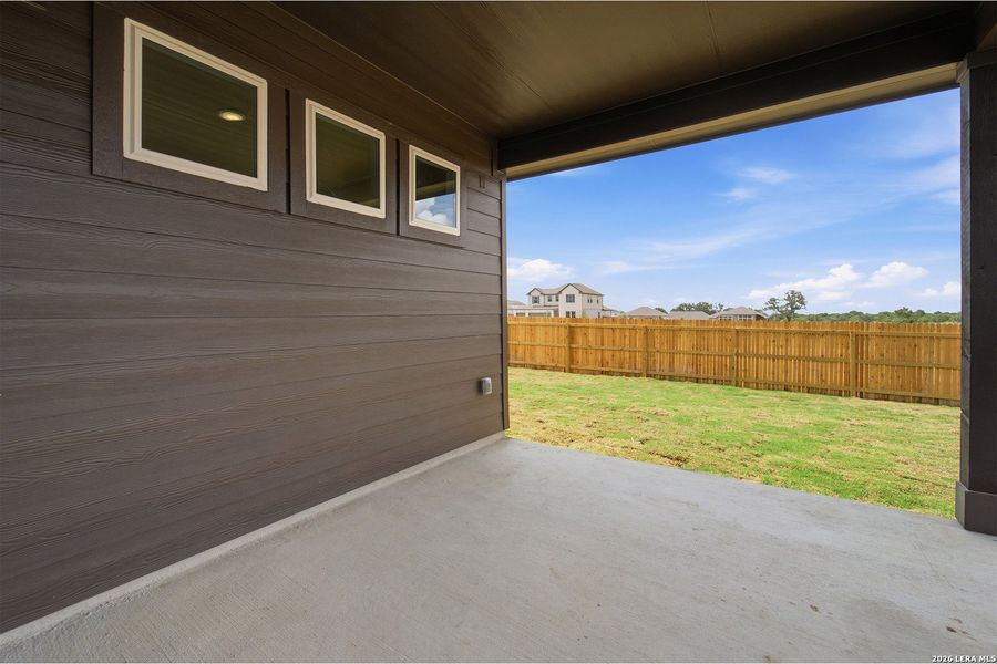 Exterior details and patio area of a home in Hickory Ridge, Elmendorf (Image 3).