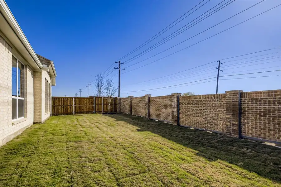 View of fenced backyard