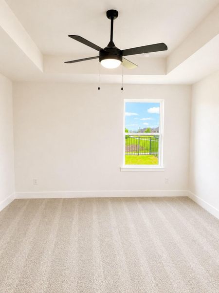 Comfortable secondary bedroom featuring soft natural light, plush carpeting, and a bright, airy layout perfect for guests or family. Comfortable secondary bedroom featuring soft natural light, plush carpeting, and a bright, airy layout perfect for guests or family.
