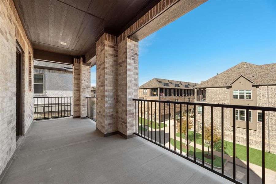 Exterior details and patio area of a home in Wade Settlement Townhomes, Frisco (Image 3).