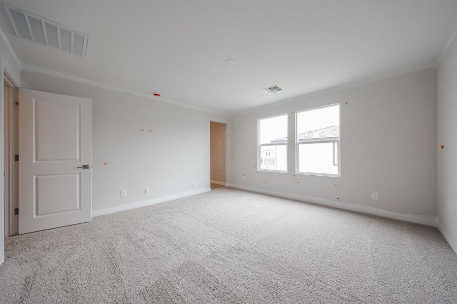 A room with white walls and a carpeted floor. A room with white walls and a carpeted floor.