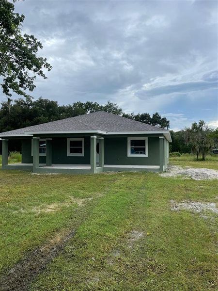 Front exterior of a new home in , Wesley Chapel, FL, highlighting curb appeal (Image 1).
