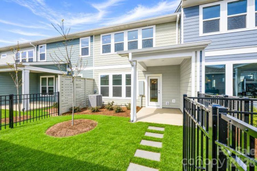 Exterior details and patio area of a home in North Creek Village - Townhomes, Huntersville (Image 4).
