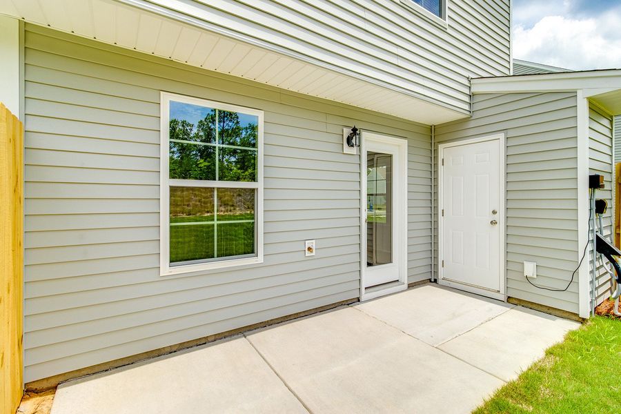 Exterior details and patio area of a home in Padgett Commons, Hopkins (Image 3).