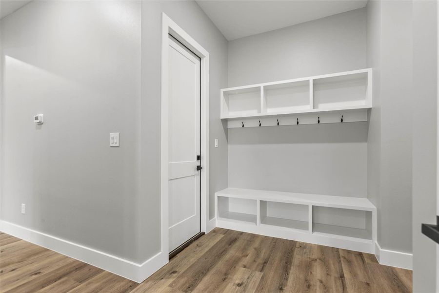 The large, and convenient mudroom area off the 3 car garage is perfect for storing backpacks, sports equipment and pet supplies. The large, and convenient mudroom area off the 3 car garage is perfect for storing backpacks, sports equipment and pet supplies.