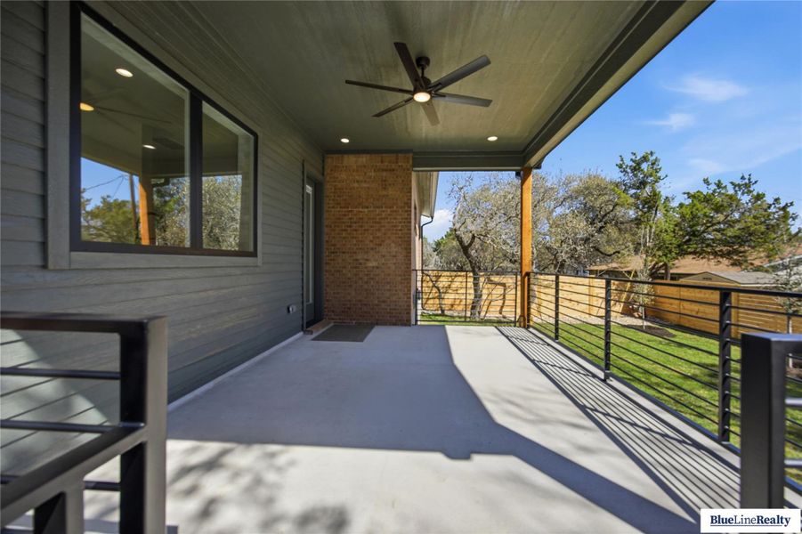 View of patio featuring ceiling fan
