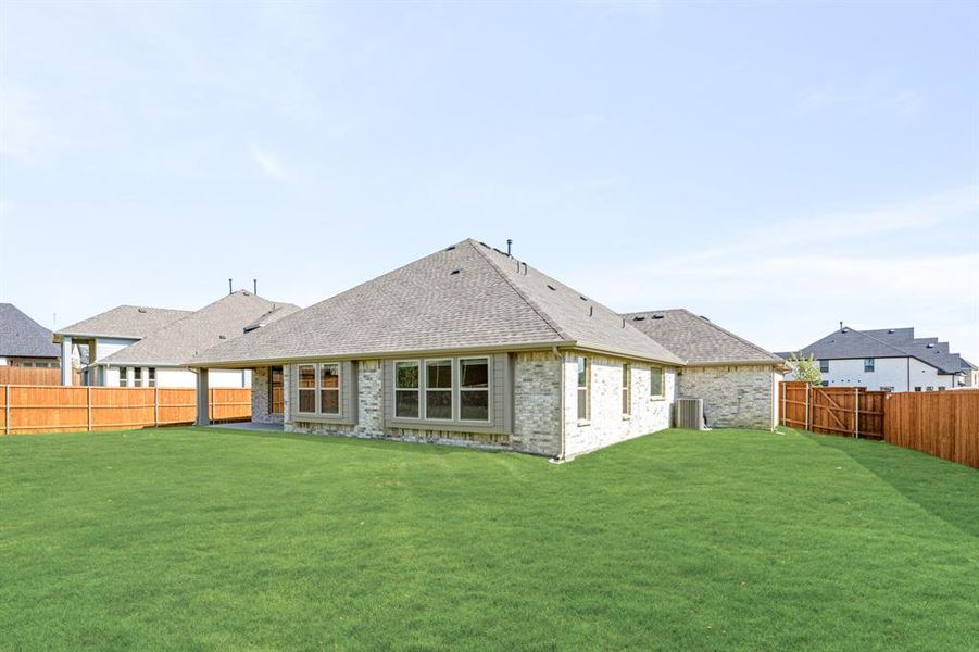 Front exterior of a new home in Rockwood 90, Mansfield, TX, highlighting curb appeal (Image 27). Front exterior of a new home in Rockwood 90, Mansfield, TX, highlighting curb appeal (Image 27).