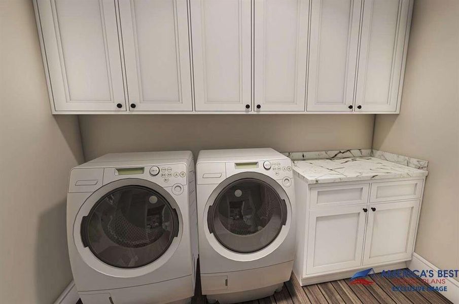 Handy counter space in a dedicated utility room with plenty of cabinet storage.