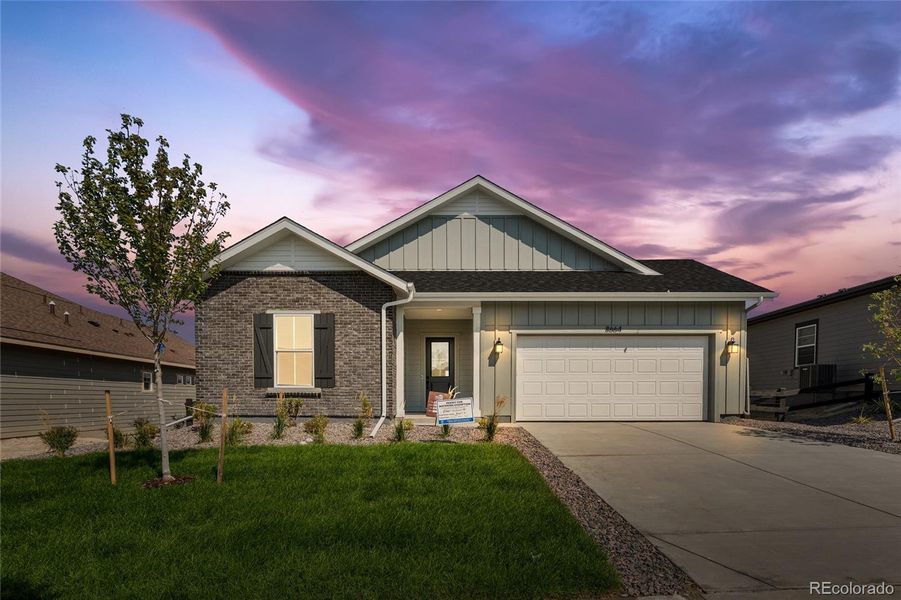 Front exterior of a new home in Hilltop at Inspiration, Aurora, CO, highlighting curb appeal (Image 14).