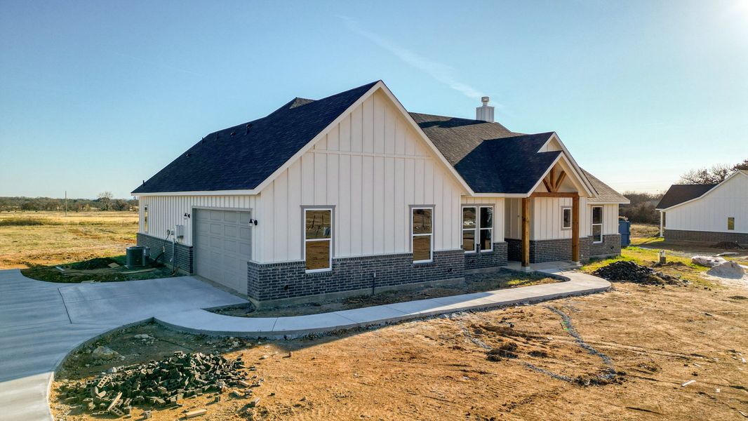 Representative exterior photo of a completed home built from the Jarrett 2 by Zeal Home Builders in Sunrise Point, Weatherford, TX (Image 19).