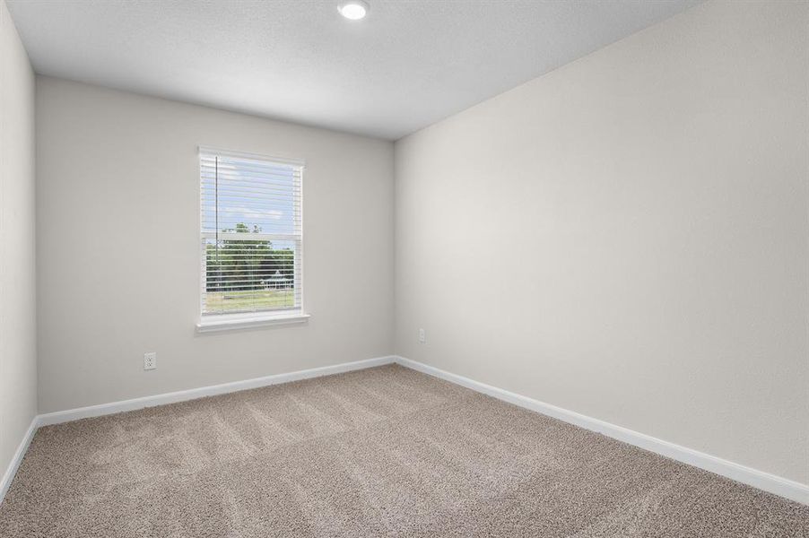 Empty room featuring baseboards and carpet floors Empty room featuring baseboards and carpet floors