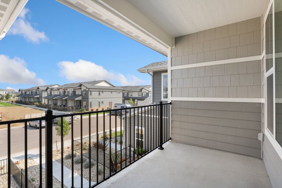 Exterior details and patio area of a home in The Lakes at Centerra, Loveland (Image 3).