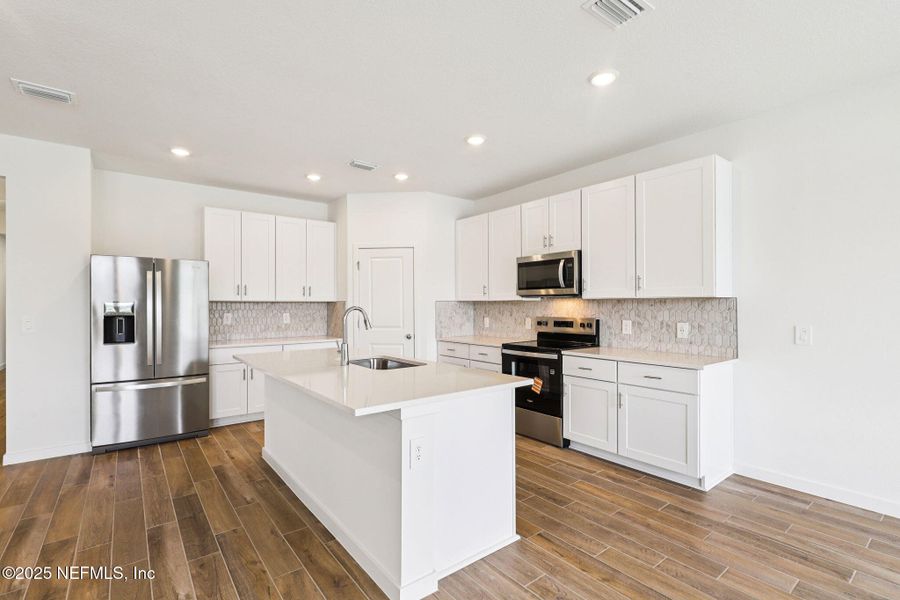 Furnished interior view inside a new home in Lakes at Bella Lago - Signature Series, Green Cove Springs (Image 8).