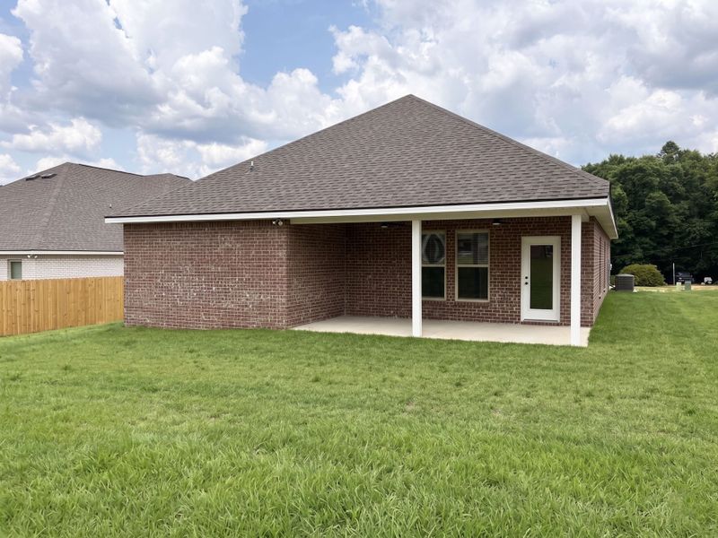 Exterior details and patio area of a home in Young Oaks, Crestview (Image 2). Exterior details and patio area of a home in Young Oaks, Crestview (Image 2).