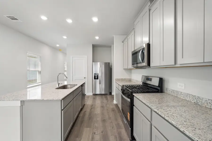 A kitchen with white cabinets. A kitchen with white cabinets.