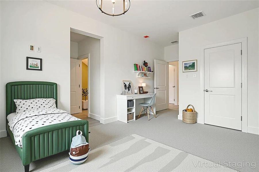 Bedroom featuring light colored carpet and a chandelier Bedroom featuring light colored carpet and a chandelier