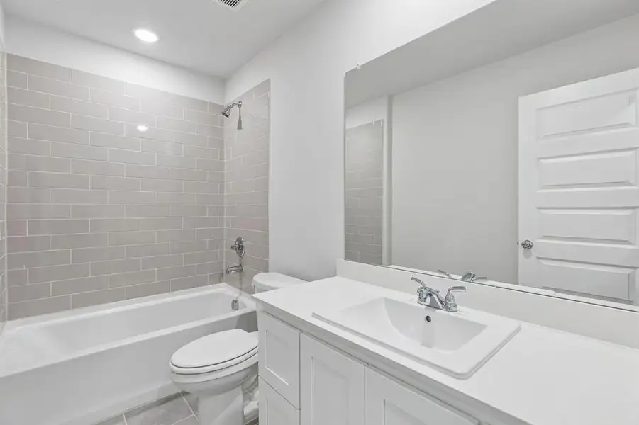 Bathroom in the Harrison home plan by Trophy Signature Homes – REPRESENTATIVE PHOTO