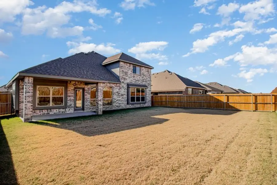 Exterior details and patio area of a home in Mustang Place II, Heartland (Image 3).