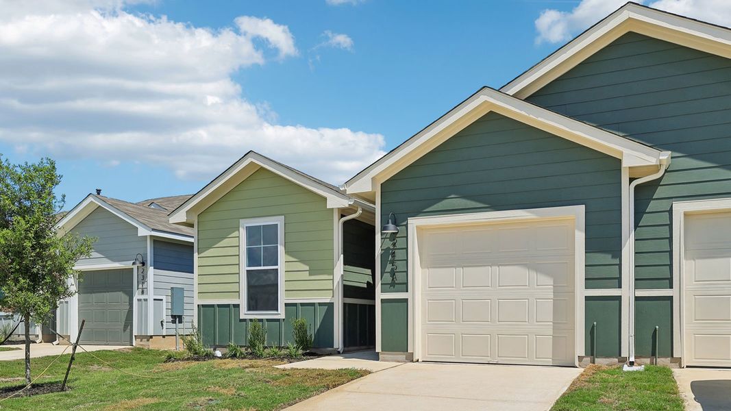 Front exterior of a new home in Wayside, Uhland, TX, highlighting curb appeal (Image 2).