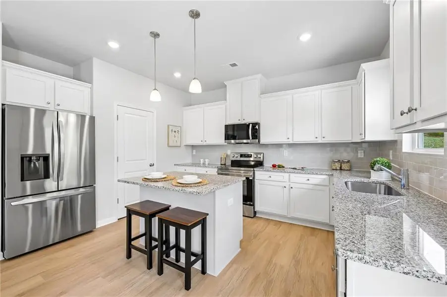 Furnished interior view inside a new home in The Hills at Cedar Creek, Winder (Image 8).