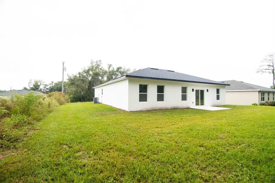 Exterior details and patio area of a home in , Ocala (Image 2).