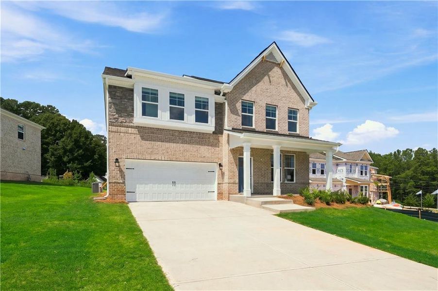 Front exterior of a new home in Burchwood, Stockbridge, GA, highlighting curb appeal (Image 17). Front exterior of a new home in Burchwood, Stockbridge, GA, highlighting curb appeal (Image 17).