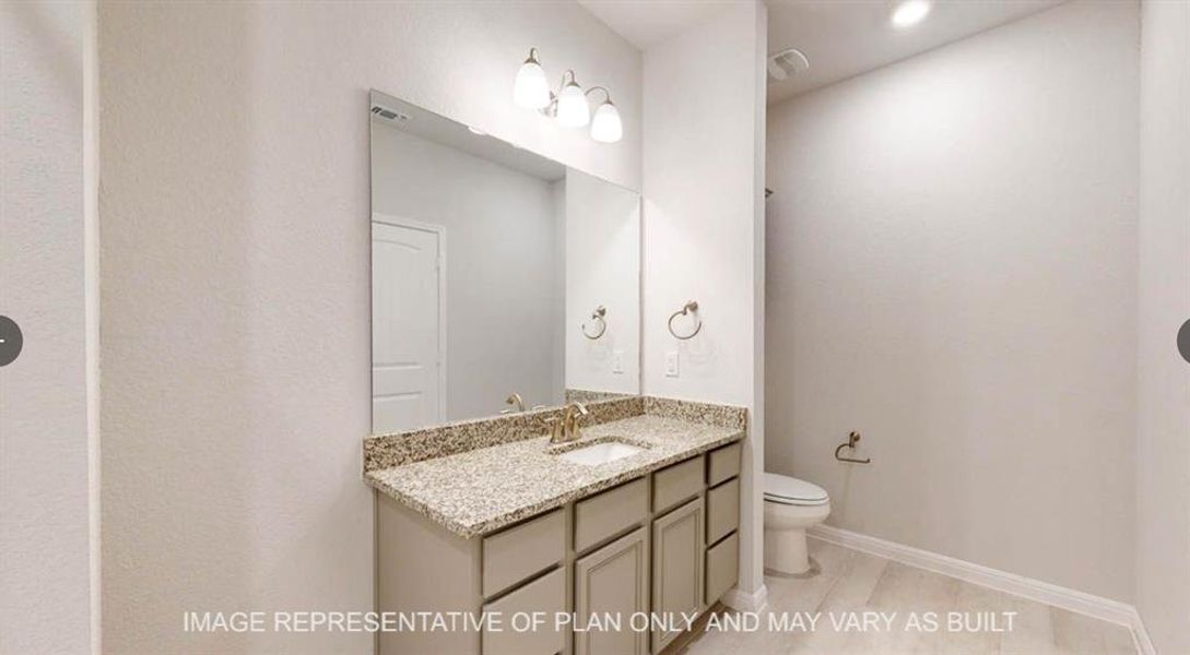 Bathroom featuring vanity, toilet, visible vents, and baseboards Bathroom featuring vanity, toilet, visible vents, and baseboards