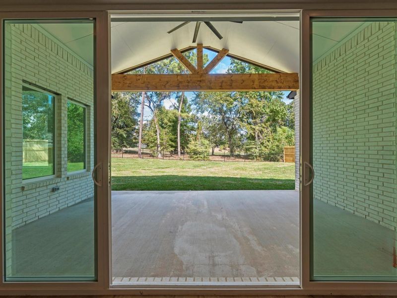 Dual french sliders open this expansive, covered, outdoor living area