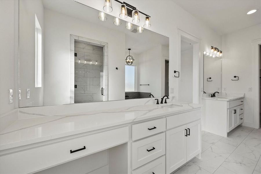 Bathroom featuring vanity and a shower with shower door