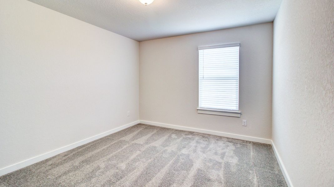 Representative furnished interior of a home built from the Majestic by Brightland Homes in Sunterra, Katy (Image 11).