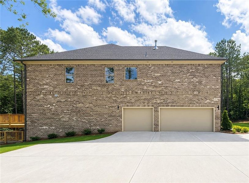 Front exterior of a new home in , Loganville, GA, highlighting curb appeal (Image 2). Front exterior of a new home in , Loganville, GA, highlighting curb appeal (Image 2).
