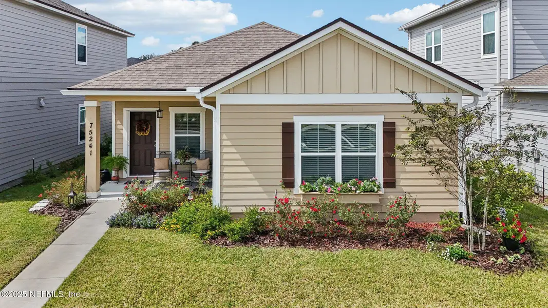 Front exterior of a new home in Tributary, Yulee, FL, highlighting curb appeal (Image 1). Front exterior of a new home in Tributary, Yulee, FL, highlighting curb appeal (Image 1).