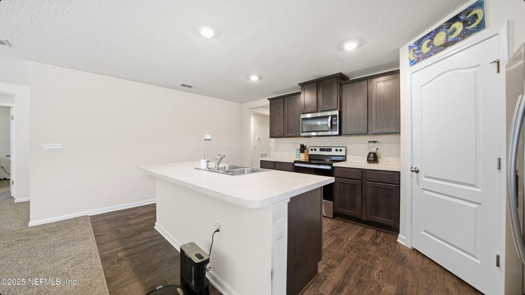Furnished interior view inside a new home in River Glen Express, Yulee (Image 18).