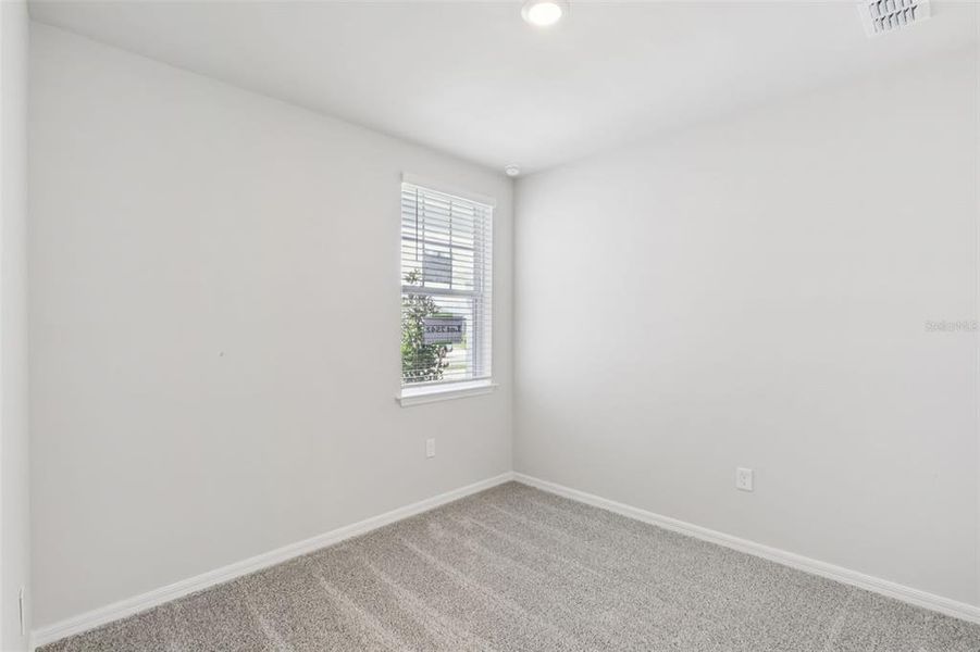 Spacious, unfurnished interior of a new home in Crescent Lakes - Premier Series, Punta Gorda (Image 16).