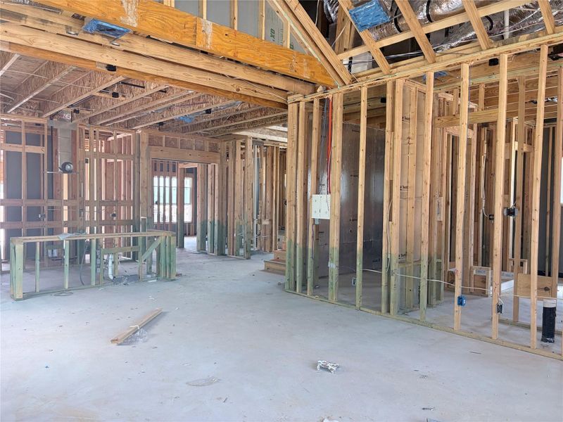 Exposed wood framing and concrete flooring outline the expansive footprint of this future custom home. Exposed wood framing and concrete flooring outline the expansive footprint of this future custom home.