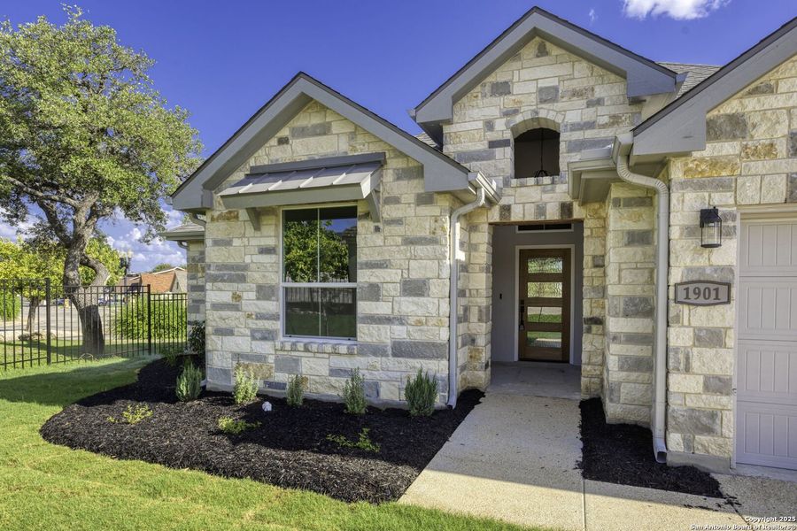 Front exterior of a new home in , Kerrville, TX, highlighting curb appeal (Image 2).