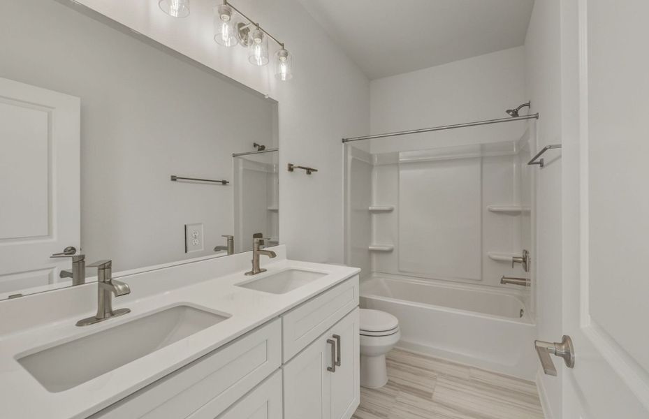 Furnished interior view inside a new home in Crosswinds, Kyle (Image 6).