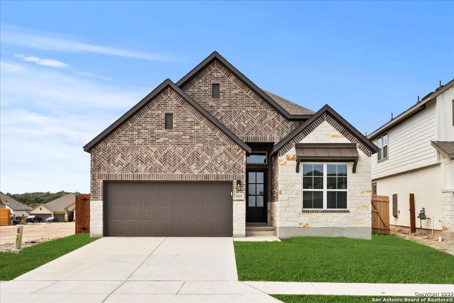 Front exterior of a new home in Meyer Ranch, New Braunfels, TX, highlighting curb appeal (Image 1). Front exterior of a new home in Meyer Ranch, New Braunfels, TX, highlighting curb appeal (Image 1).