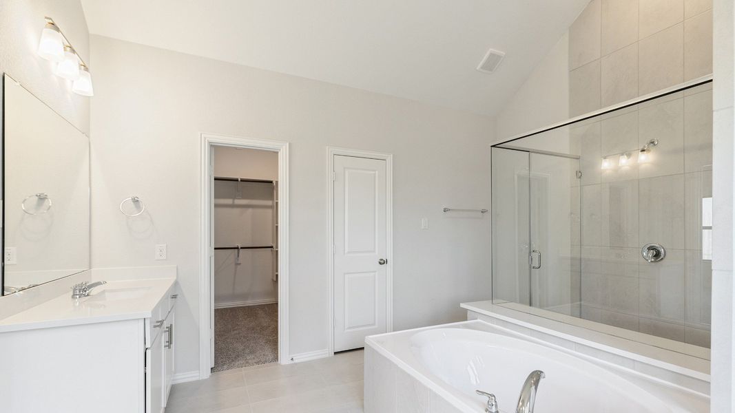 Furnished interior view inside a new home in Sunterra, Katy (Image 23).