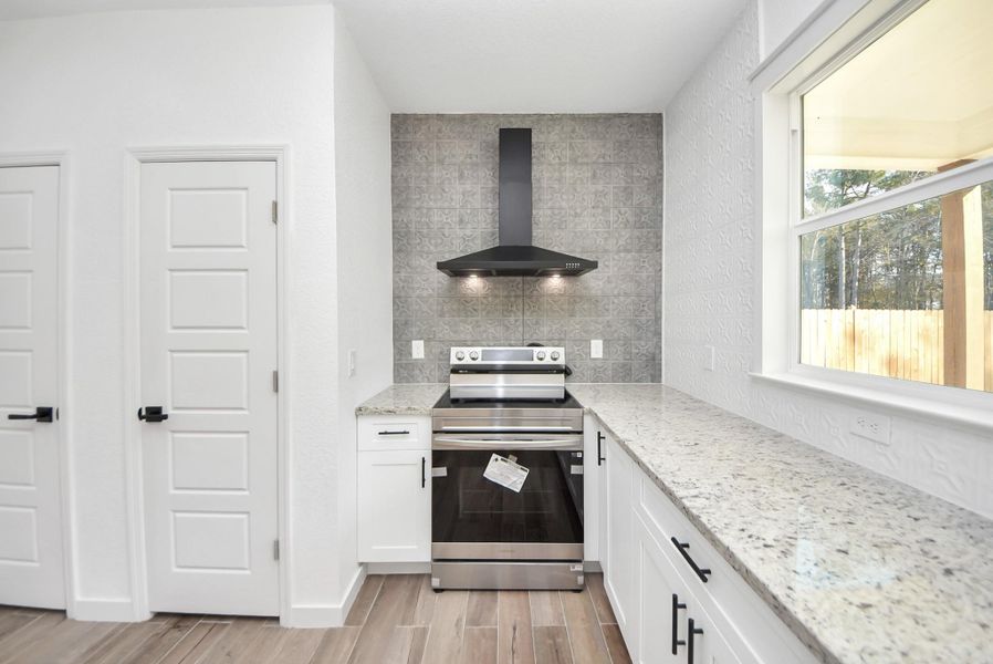 Furnished interior view inside a new home in , Conroe (Image 11).