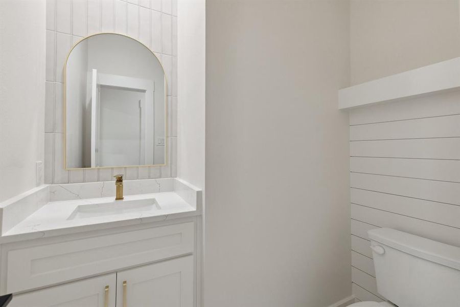 Half bath with toilet and vanity