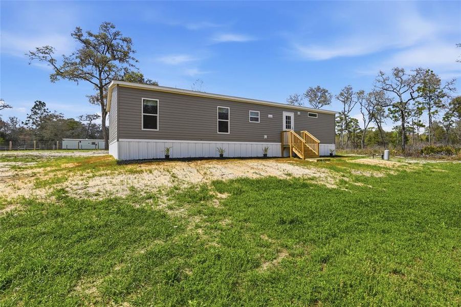 Exterior details and patio area of a home in , Morriston (Image 24).