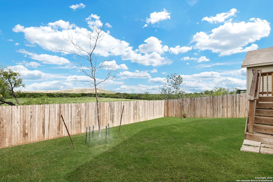 Exterior details and patio area of a home in Crescent Hills: Cottage Collection, San Antonio (Image 3).