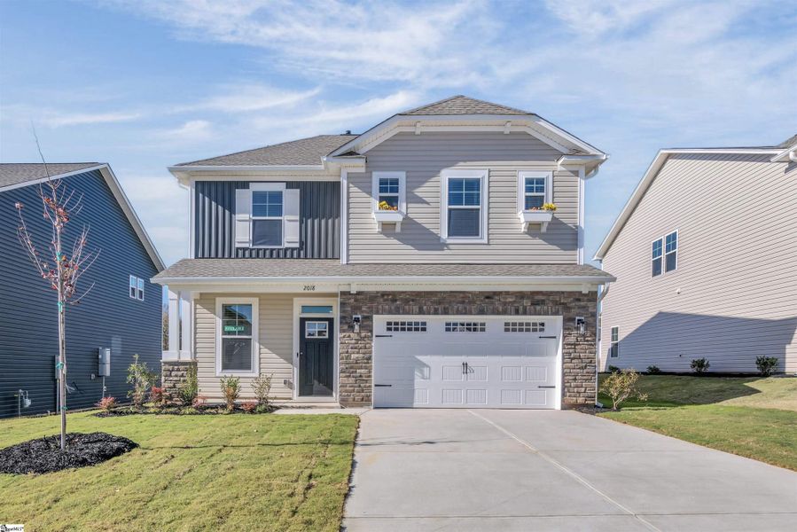Front exterior of a new home in Halton Oaks, Spartanburg, SC, highlighting curb appeal (Image 2).
