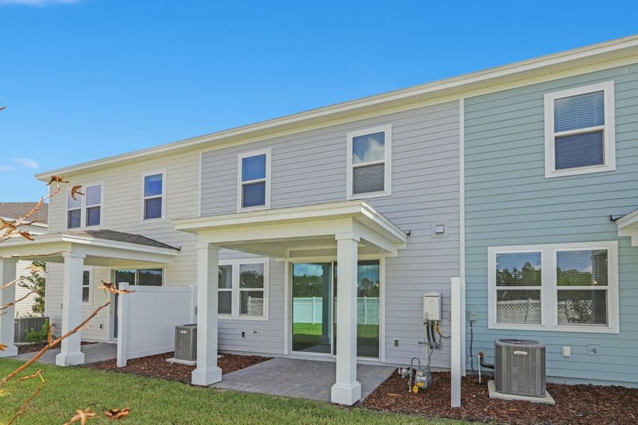 Exterior details and patio area of a home in Cherry Elm at SilverLeaf, St. Augustine (Image 2). Exterior details and patio area of a home in Cherry Elm at SilverLeaf, St. Augustine (Image 2).