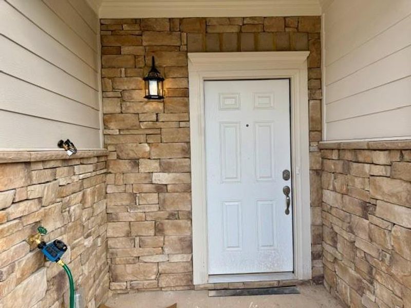 Exterior details and patio area of a home in Park Center Pointe, Mableton (Image 3).