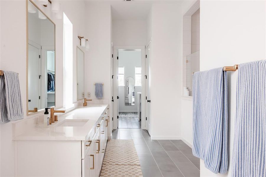 The primary bath is oversized and filled with natural light.