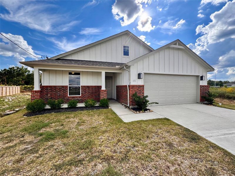 Front exterior of a new home in , Cleveland, TX, highlighting curb appeal (Image 14).