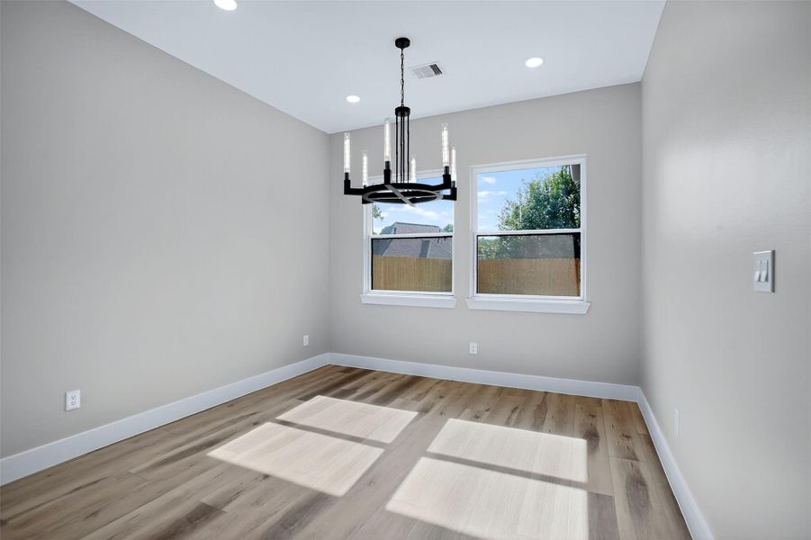 The dining area features plenty of warm, natural light